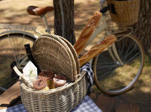 a basket full of bread and donuts on a table at Domotel Kastri in Athens
