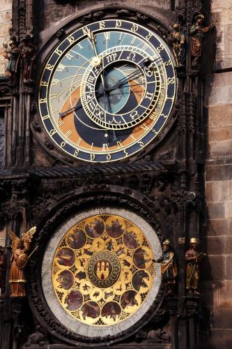 a large clock on the side of a building at Prague Old Town Liliova Garden in Prague
