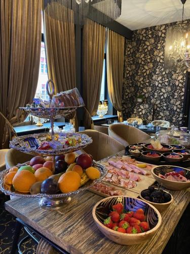 a buffet with many plates of food on a table at 't Hartje van Brugge in Bruges