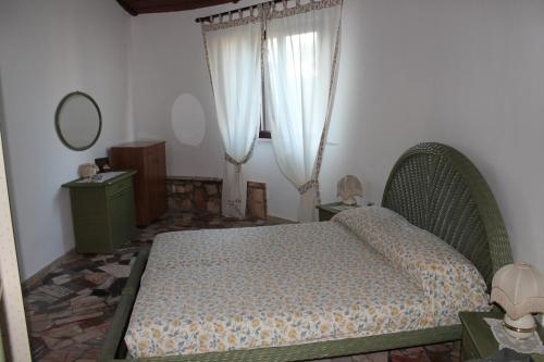 En eller flere senge i et værelse på Ville Alba & Azzurra