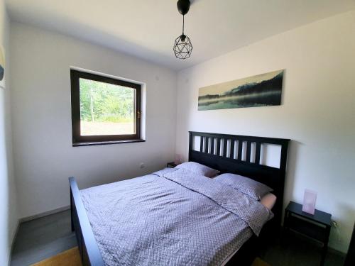 Кровать или кровати в номере Evergreen house Plitvice