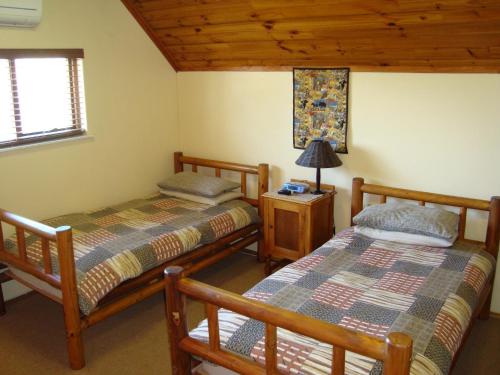 Łóżko lub łóżka w pokoju w obiekcie Pentzhaven Guesthouse
