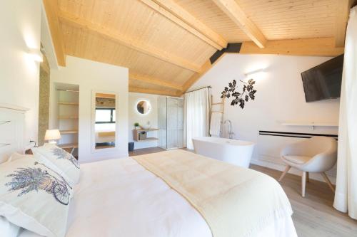 Tempat tidur dalam kamar di Landras de Compostela