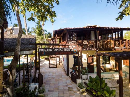 a building with a sign that reads pueblulated caribbean hotel at Pousada Capitão Thomaz in Jericoacoara
