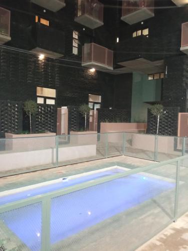 an empty swimming pool in a building at night at Maboneng City Building Free WiFi and Swimming pool in Johannesburg