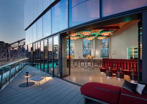 a balcony of a building with a view of the city at Graduate New York in New York