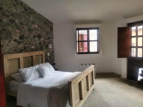 Postel nebo postele na pokoji v ubytování Hotel Canaria