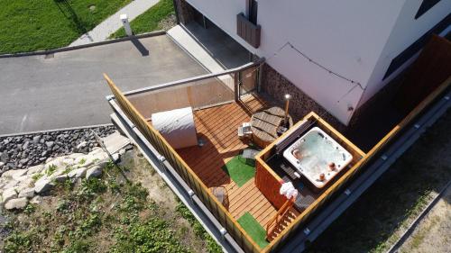 an overhead view of a house with a swimming pool at Apartmány Tri sestry Jasná in Demanovska Dolina