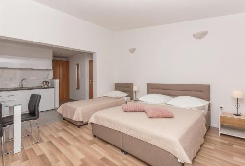 Posteľ alebo postele v izbe v ubytovaní Nina seaview