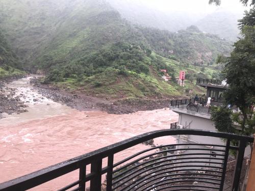 a view of a river from a balcony at Hotel La Orilla Muzaffarabad in Muzaffarabad