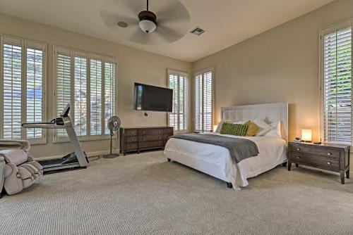 a bedroom with a bed and a flat screen tv at Near Golf Glendale Oasis with Pool and Hot Tub! in Phoenix