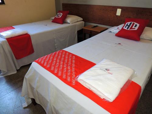 Una cama o camas en una habitación de Hotel Líder