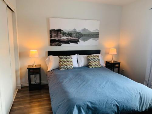 Ein Bett oder Betten in einem Zimmer der Unterkunft Le Philémon Club Azur plage Memphrémagog