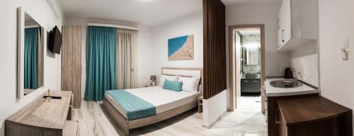 a hotel room with a bed and a sink at Villa Irina sea view in Sykia Chalkidikis