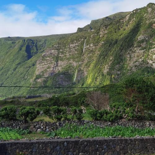 a mountain with a waterfall on it at Casa da Sogra - Apartamento 2 in Faja Grande
