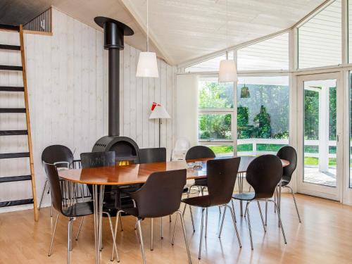a dining room with a table and chairs at 10 person holiday home in V ggerl se in Marielyst