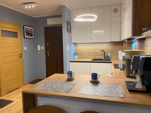 Η κουζίνα ή μικρή κουζίνα στο Apartament Amber