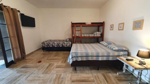 A bed or beds in a room at Suítes econômica Flor de Maria