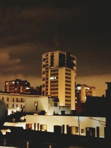 a view of a city skyline with a tall building at Hôtel Sid El Aidi Médina in Rabat
