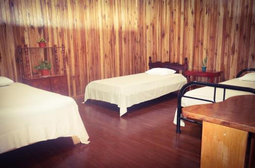 Katil atau katil-katil dalam bilik di Monte Los Lirios Lodge