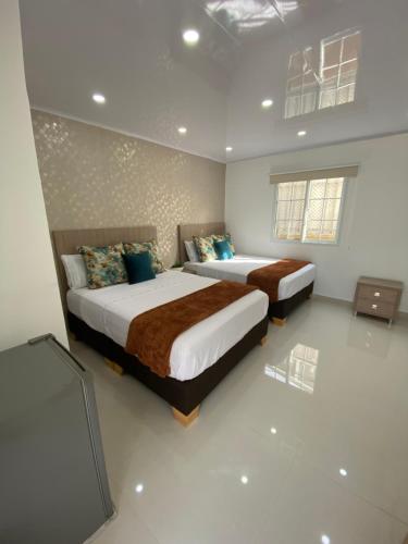 Posteľ alebo postele v izbe v ubytovaní Casa hotel boutique habibi - San Andres Islas