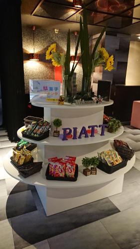 a table with different types of food on a display at Hotel Piatt (Adult Only) in Nagoya
