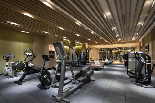 a gym with treadmills and exercise equipment in a building at Crowne Plaza Shanghai Nanjing Road, an IHG Hotel in Shanghai