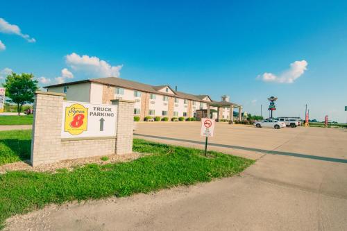 a hotel sign on the side of a road at Super 8 by Wyndham McLean/Bloomington SW in McLean