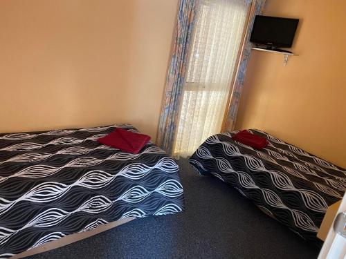Ένα ή περισσότερα κρεβάτια σε δωμάτιο στο Motel Mount Gambier