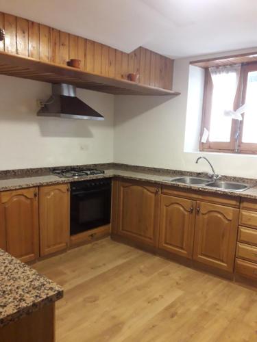 Kuchyň nebo kuchyňský kout v ubytování L'Oficial