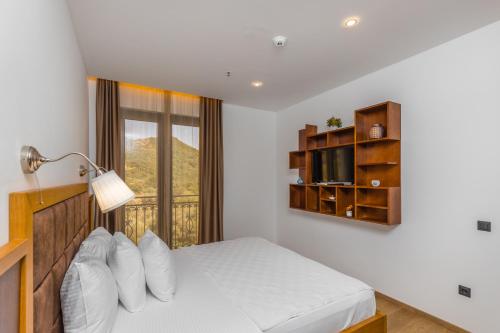 Una cama o camas en una habitación de Hotel Plaza Lucice