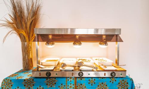 a counter with several dishes and utensils on a table at Zanziblue Boutique Villas in Matemwe