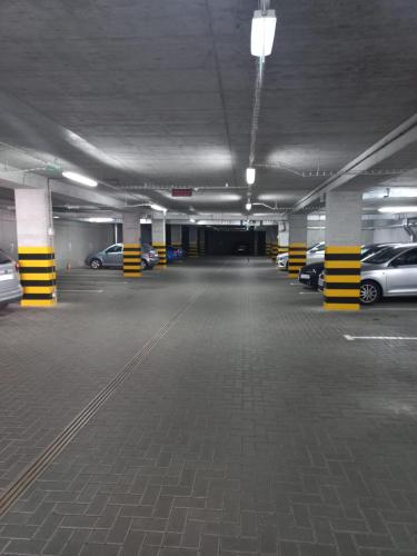an empty parking garage with cars parked in it at Lubhotel in Lublin
