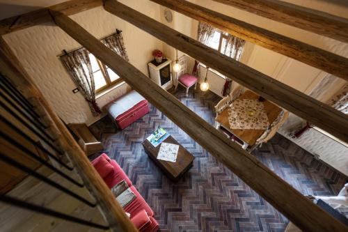 an overhead view of a living room with red furniture at Rose garden in Ljubno