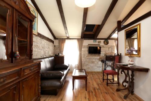a living room with a couch and a table at Villa Carrara in Trogir