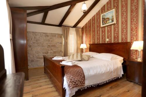 a bedroom with a large bed in a room at Villa Carrara in Trogir