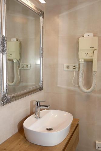 a bathroom with a sink and a mirror at Villa Carrara in Trogir