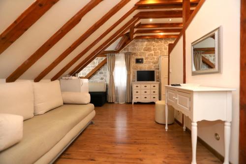 a living room with a couch and a table at Villa Carrara in Trogir