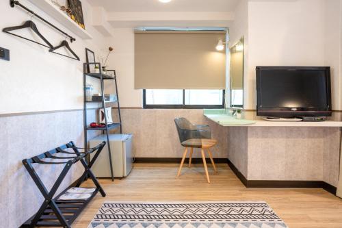TV a/nebo společenská místnost v ubytování New Generation of Boutique Business Hotel