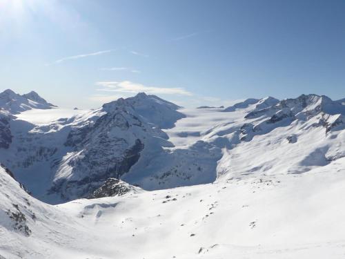 a snow covered mountain range with snow on it at Il Rododendro in Ponte di Legno
