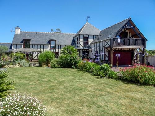 a large house with a large yard at Holiday Home Valhalla- chez Jules by Interhome in Planguenoual