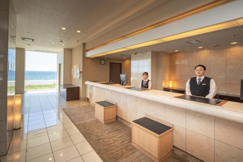 Členové personálu v ubytování Imagine Hotel & Resort