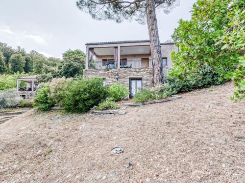 an empty yard in front of a house at Holiday Home A Mandria by Interhome in Ghisoni
