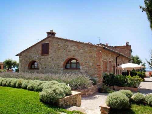 an old stone house with a garden in front of it at Apartment San Lorenzo-4 by Interhome in Castagno