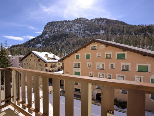 a balcony of a building with a mountain in the background at Apartment Chesa Islas by Interhome in Pontresina