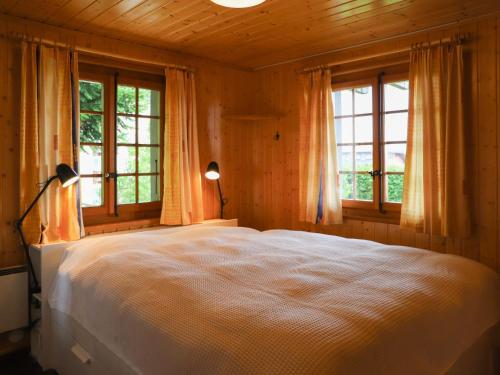 Katil atau katil-katil dalam bilik di Chalet Chalet Les Rochers Blancs by Interhome