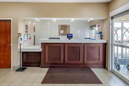 a hospital room with a counter and a mirror at Comfort Inn Oklahoma City in Oklahoma City