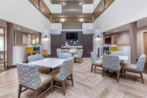a waiting room at a hospital with tables and chairs at Comfort Suites Anderson-Clemson in Anderson