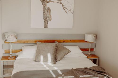 מיטה או מיטות בחדר ב-Aqua Marina Guest House
