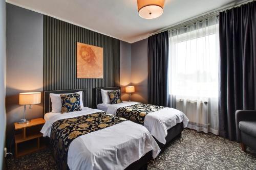 Кровать или кровати в номере Hotel DaVinci